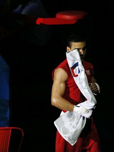 Nordine Oubaali of France leaves the ring following victory over Ajmal Faisal of Afghanistan